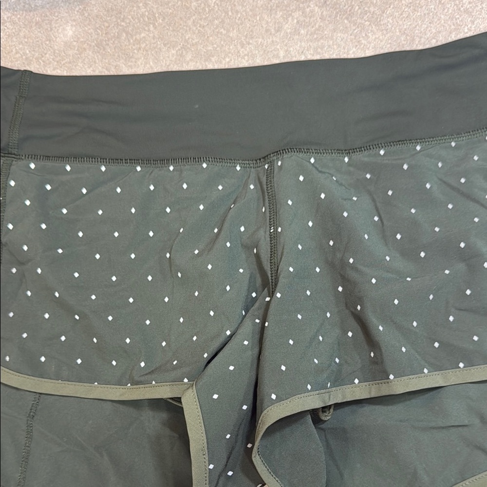 Lululemon shirts size 10.  Zipper pocket in back